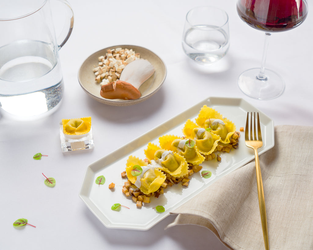 Tortelloni al brasato con cardoncelli e fonduta al parmigiano